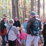Hike Leader Bernard talking with children about things we find along the trail.